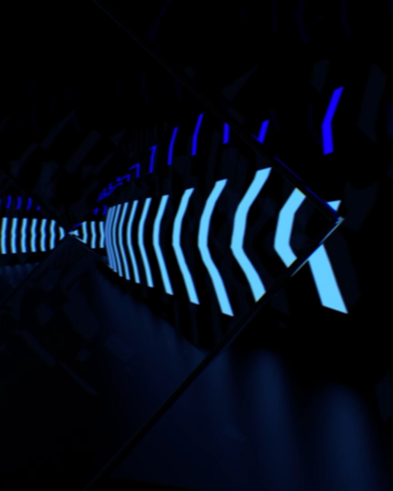 Digital blue lights in a repeating arrow pattern on a black background