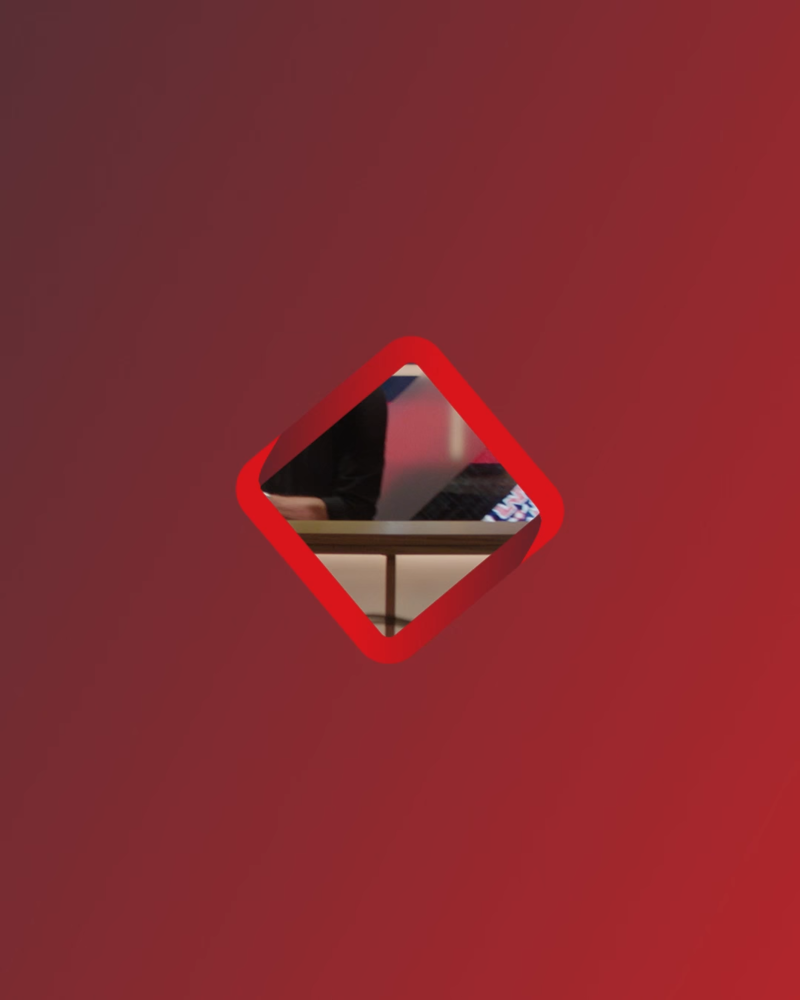 A digital red asset with a close up red framed diamond and image in the middle